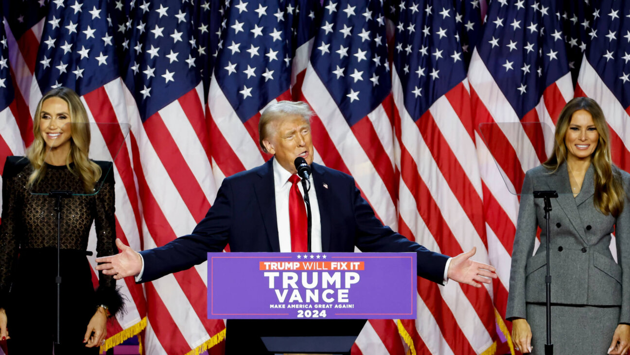 Former President Donald Trump and former first lady Melania Trump celebrate during an election night event in Florida.