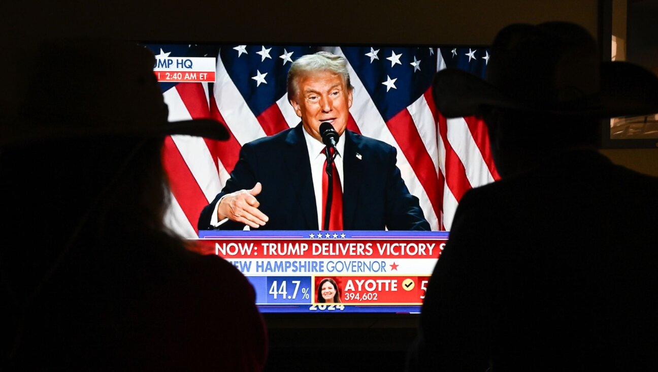 A couple watches President Donald Trump’s victory speech from a TV screen, Nov. 5, 2024, in Foster City, Calif. (Tayfun Coskun/Anadolu via Getty Images)