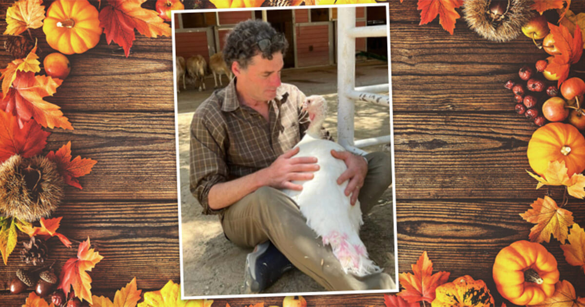 Rob Eshman hugging Justice the turkey at Gentle Barn in Santa Clarita, Calif.