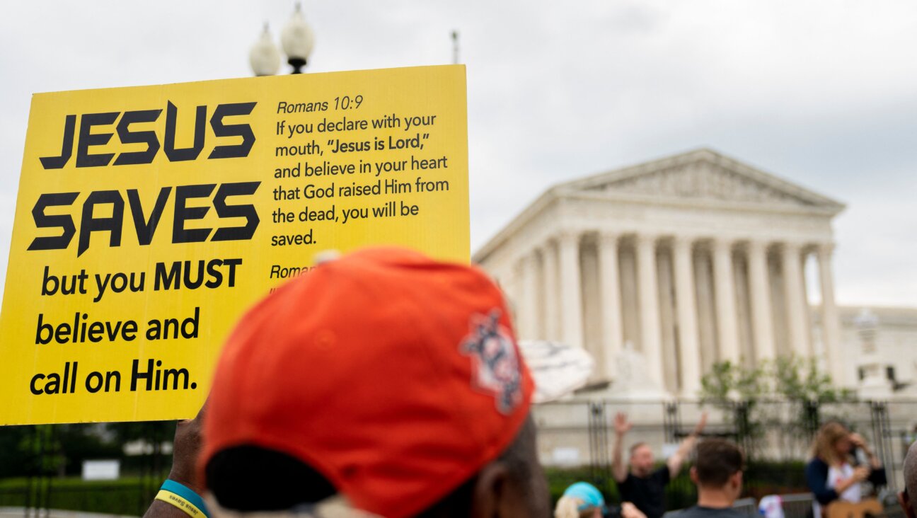 A person holds a Jesus Saves sign outside the U.S. Supreme Court on June 27, 2022.