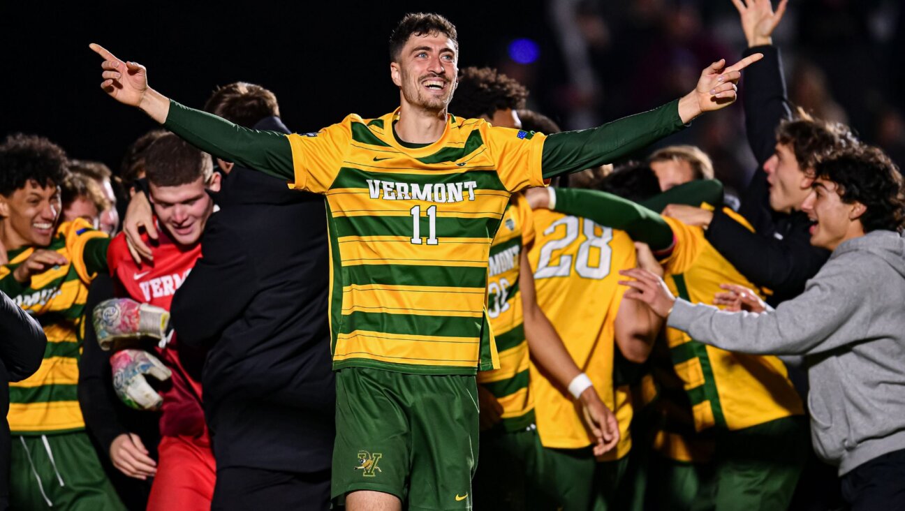 Yaniv Bazini celebrates after the 2024 Division I semifinals, Dec. 13, 2024, in Cary, North Carolina. (Anthony Sorbellini/NCAA Photos via Getty Images)