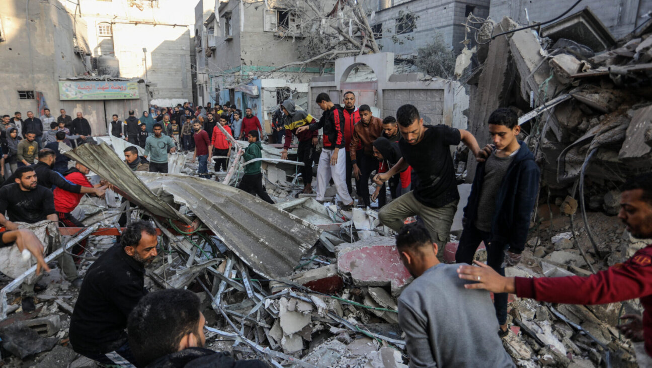 Palestinians look for survivors after an Israeli airstrike on a house belonging to the Adwan family in Rafah in the southern Gaza Strip, Dec. 1, 2023. (Abed Rahim Khatib/dpa via Getty Images)