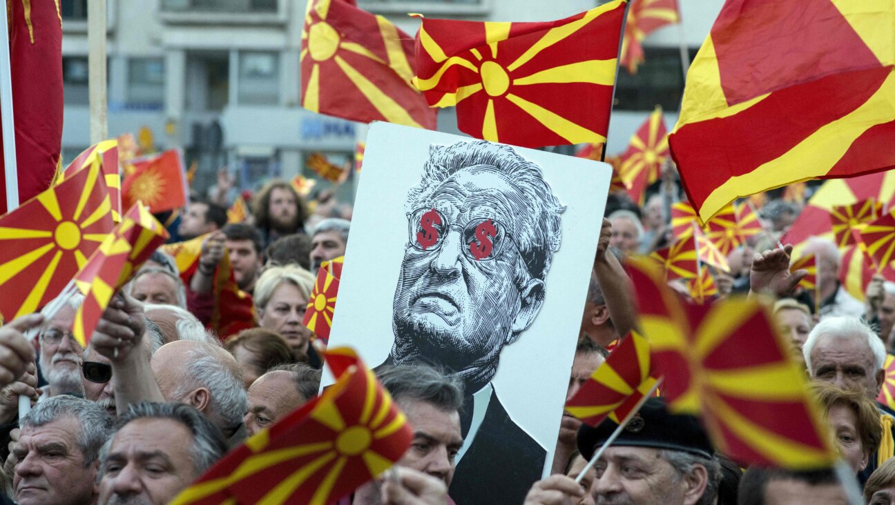 George Soros, depicted on a poster at a demonstration in Macedonia in 2017, was is among the targets of the Heritage Foundation's Project Esther.