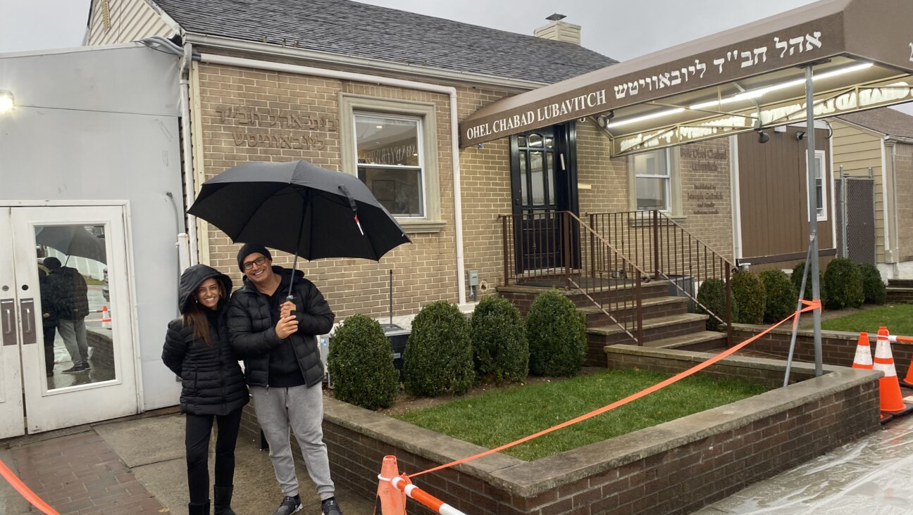 Odelia Karo (left) and her brother Nadir (right) outside the Ohel's visitor center in Queens, New York