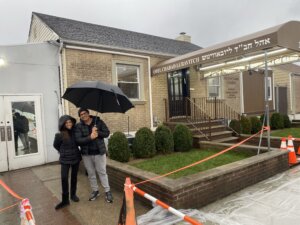 Odelia Karo (left) and her brother Nadir (right) outside the Ohel's visitor center in Queens, New York