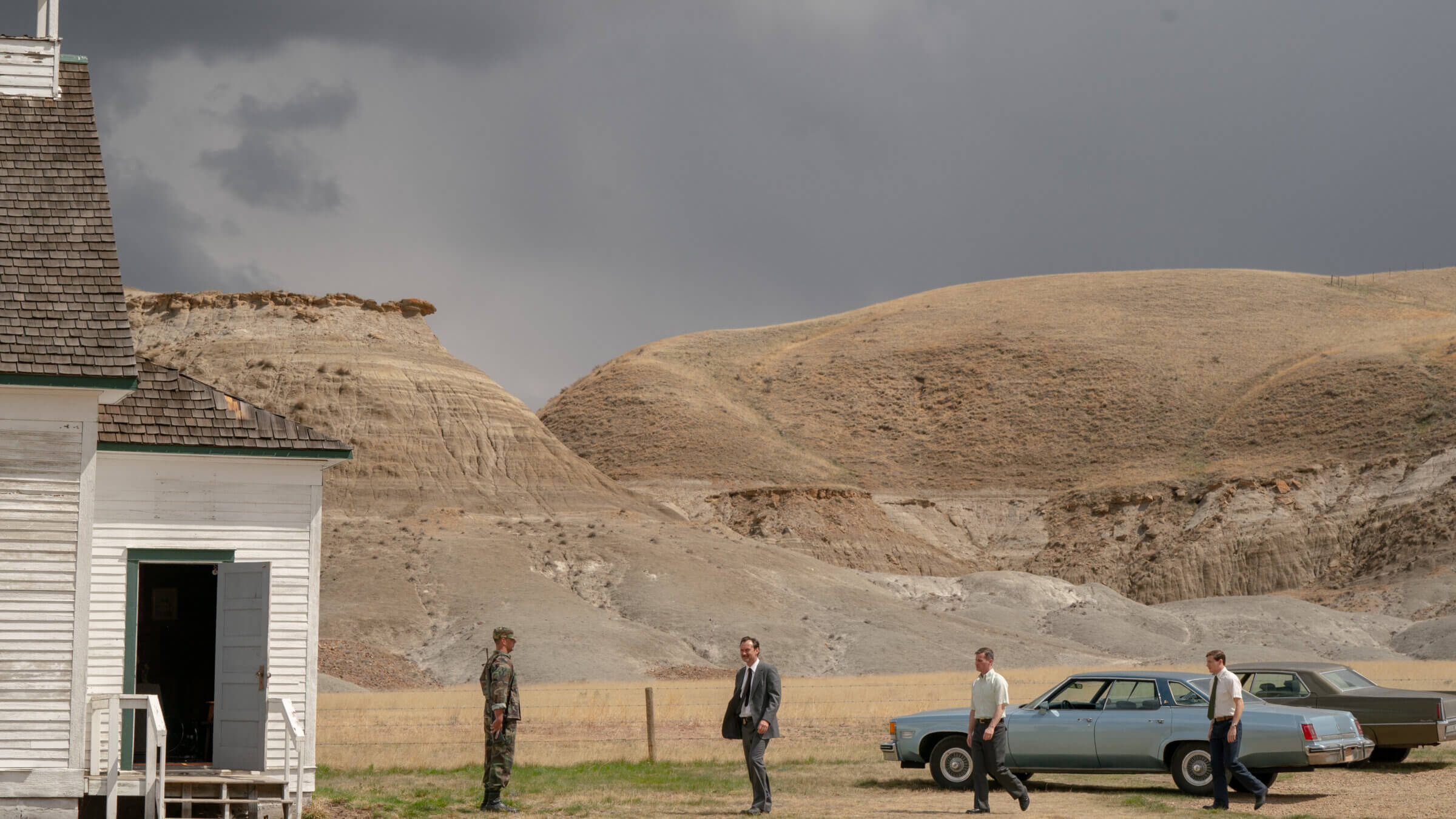 Jude Law visits a white power compound in <i>The Order.</i>
