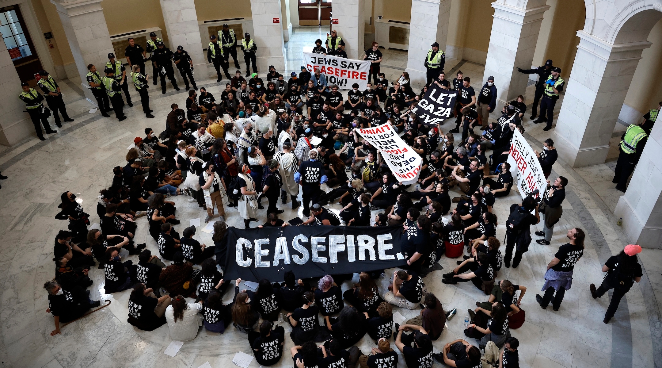 Demonstrators from Jewish Voice for Peace and the IfNotNow movement hold a rally demanding a ceasefire in Gaza in the rotunda of the Cannon House Office Building in Washington, D.C. on Oct. 18, 2023. (Chip Somodevilla/Getty Images)