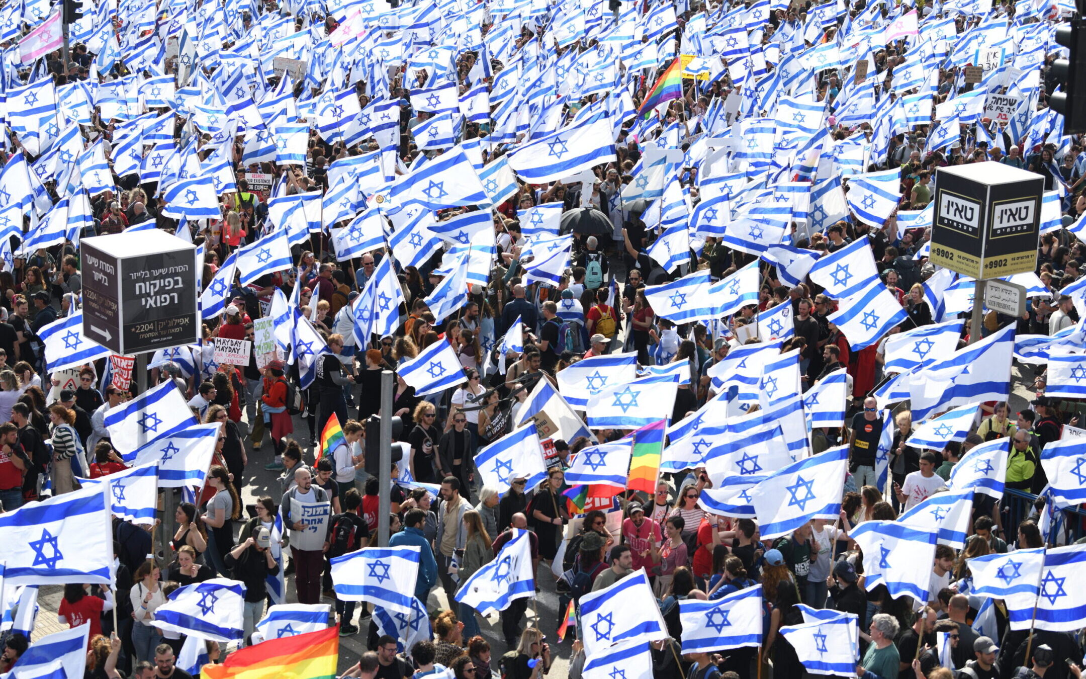 Thousands of Israeli protesters wave flags during a rally against the Israeli government’s judicial overhaul bills in Jerusalem, March 27, 2023. (Gili Yaari/Flash90)