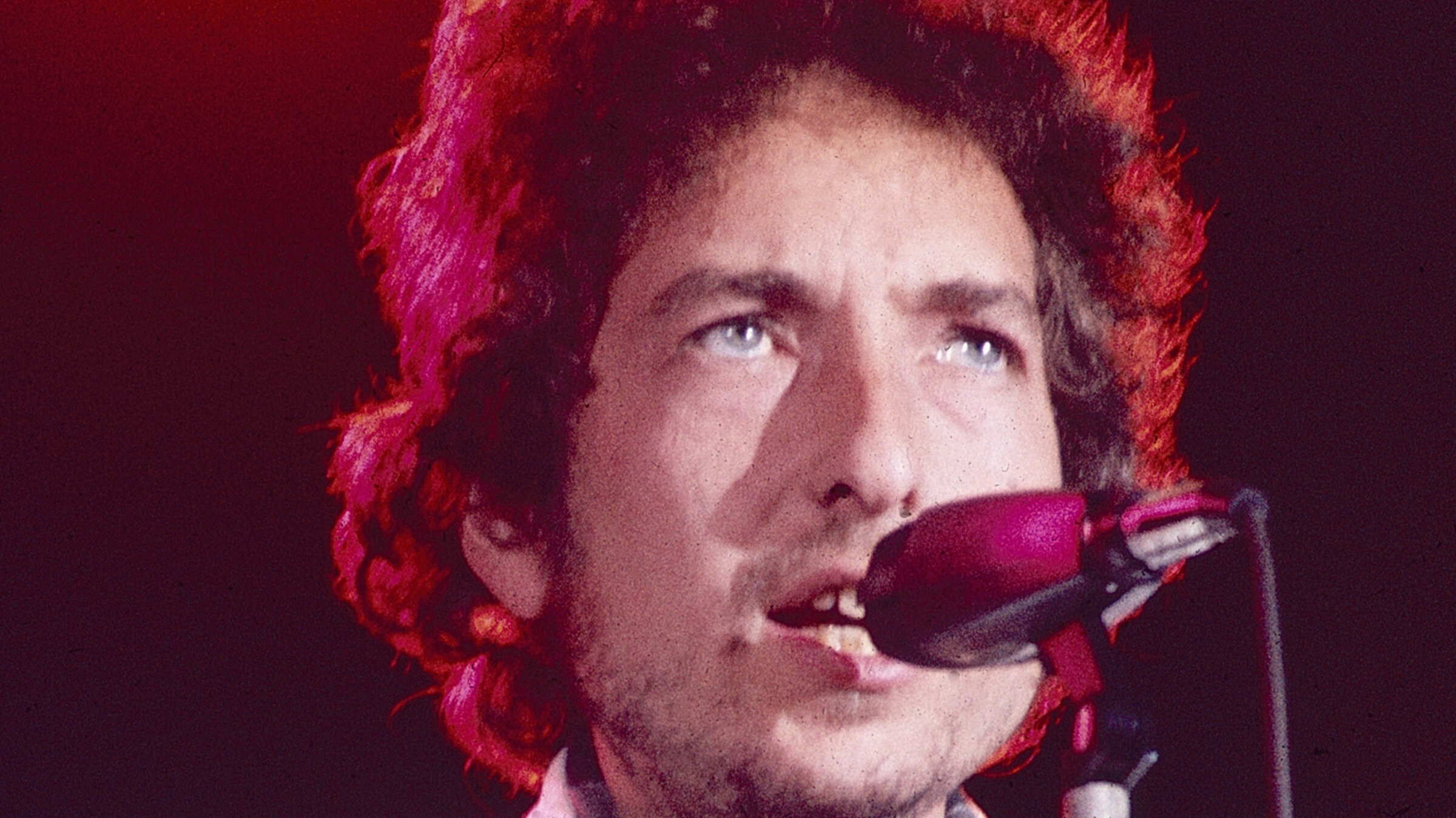 Bob Dylan performs with The Band in 1974, one year before the release of <i>Blood on the Tracks</i>.