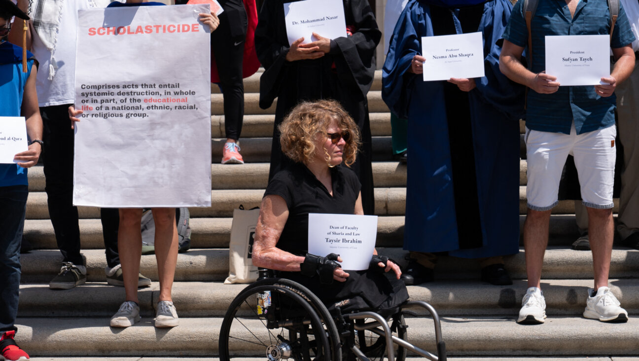 Faculty from the University of Texas in Austin gather to protest what they term 'scholasticide' in Gaza.