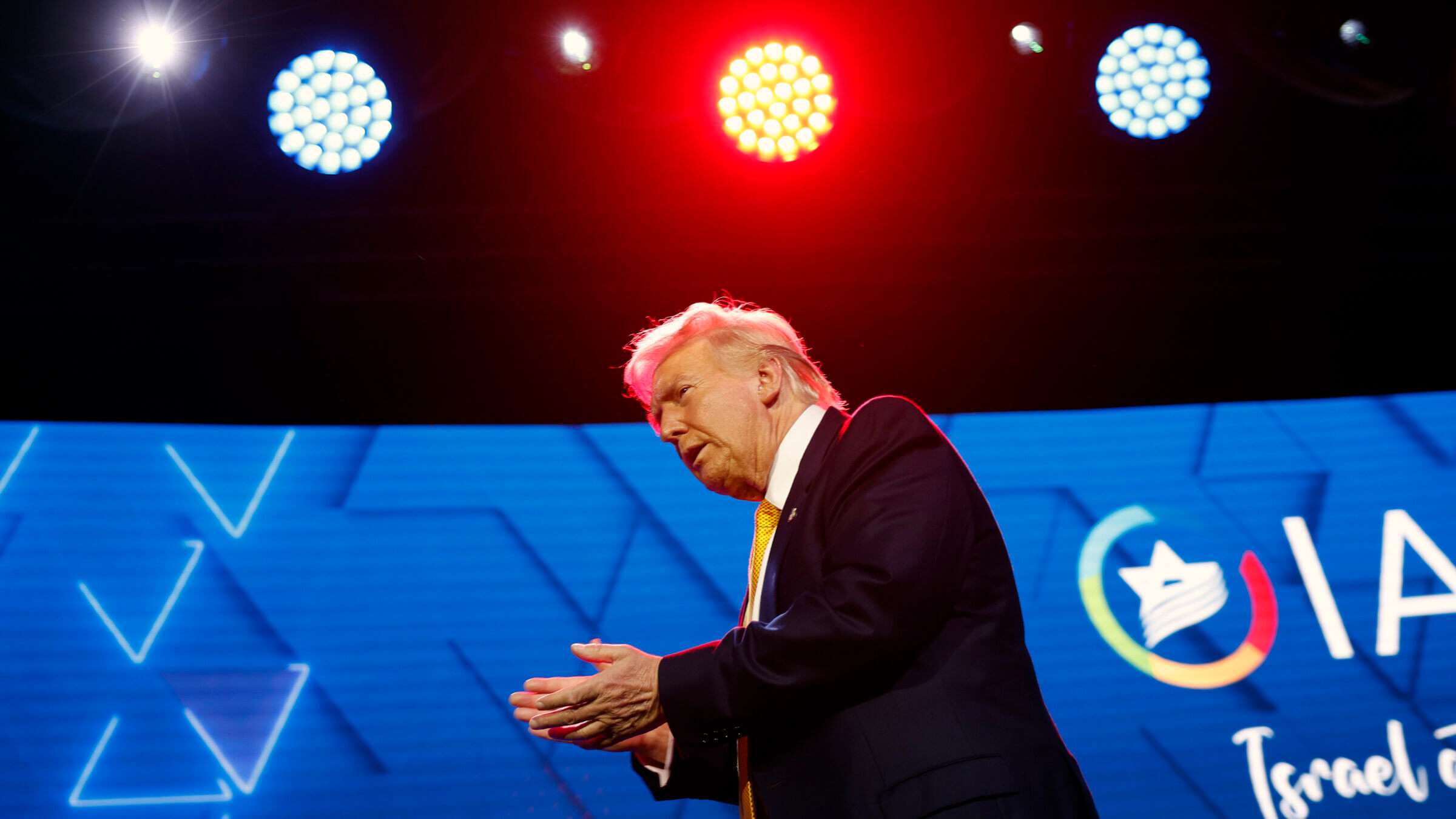 President Donald Trump leaves the stage after speaking at the Israeli American Council National Summit at the Washington Hilton in September.