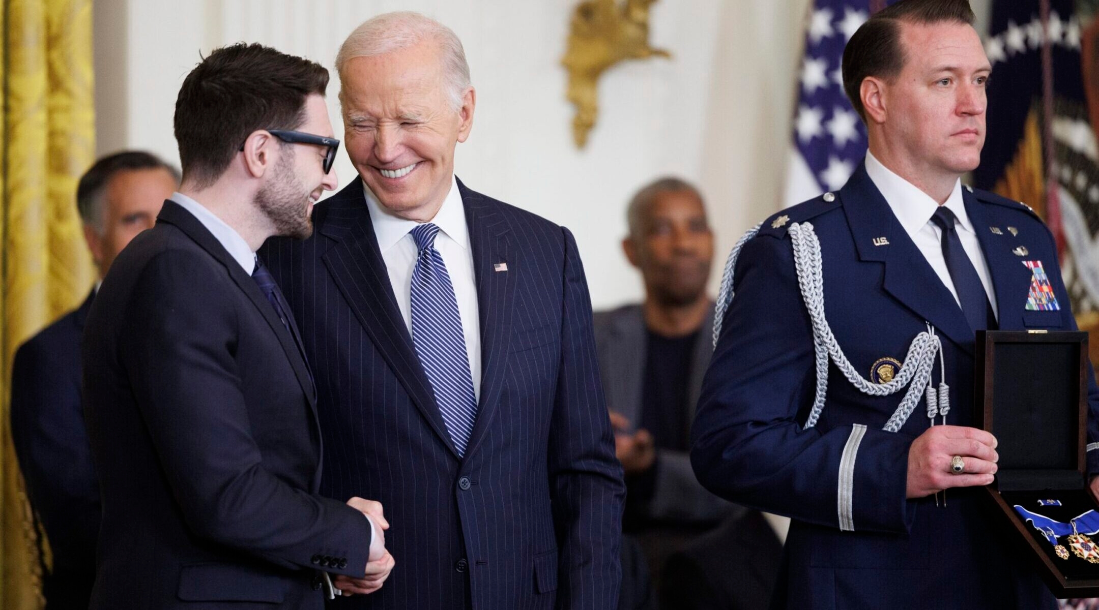 Alex Soros, son of philanthropist George Soros, greets U.S. President Joe Biden before being presented the Presidential Medal of Freedom on behalf of his father in the East Room of the White House, Jan. 4, 2025. (Tom Brenner/Getty Images)