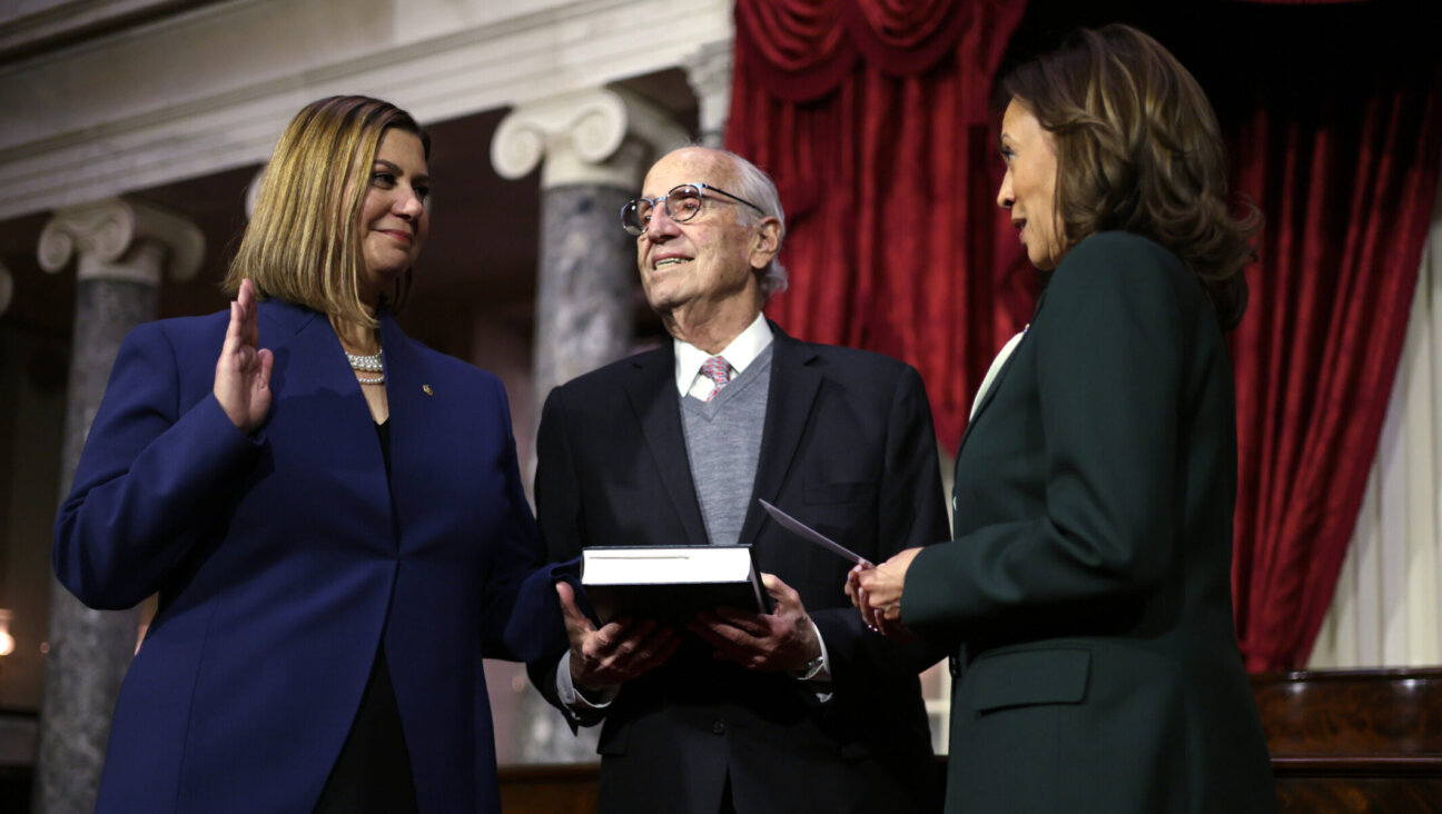 U.S. Vice President Kamala Harris (R) participates in a ceremonial swearing-in with Sen. Elissa Slotkin, as her father Curt holds a Jewish text at the U.S. Capitol, Jan. 3, 2025. (Alex Wong/Getty Images)