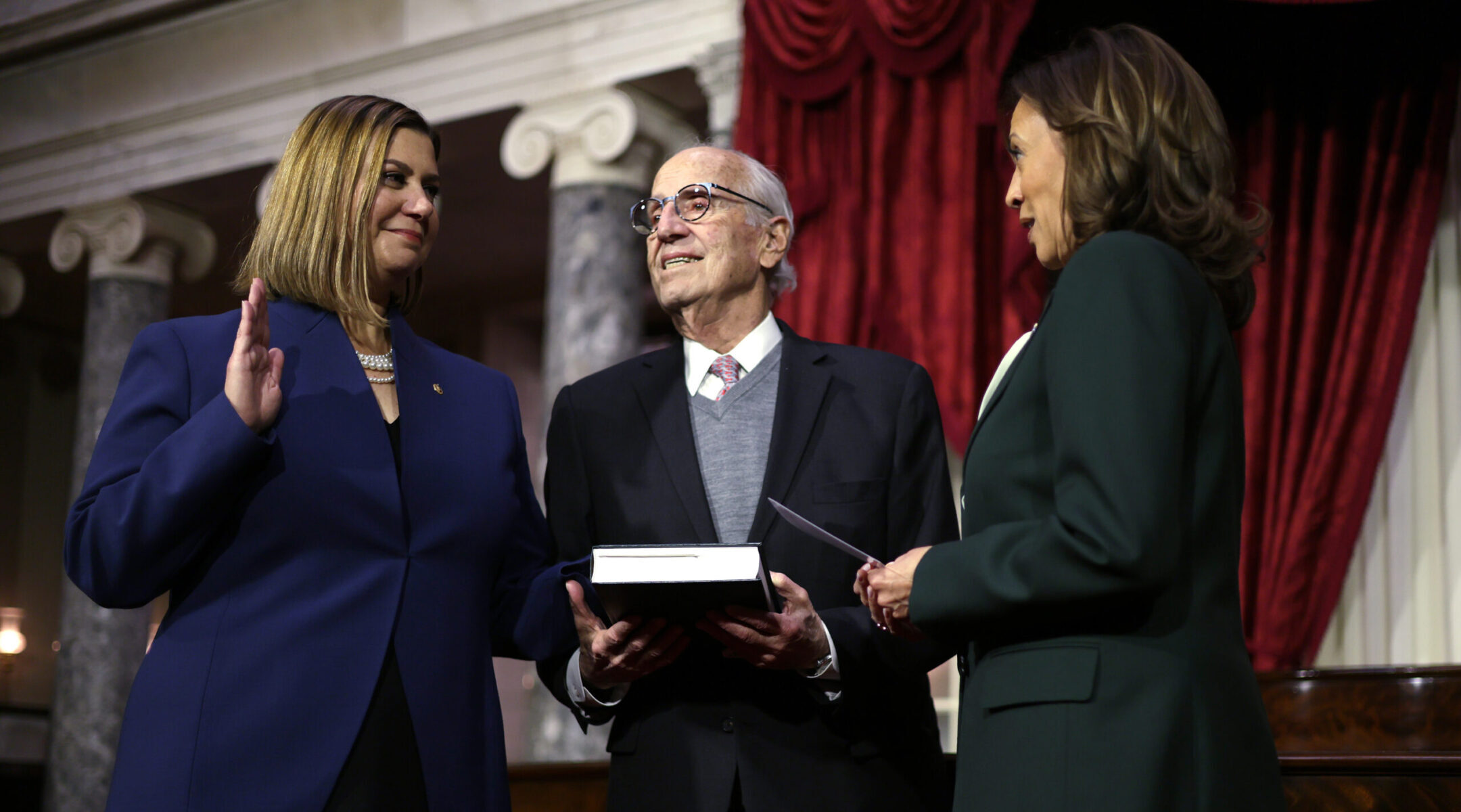 U.S. Vice President Kamala Harris (R) participates in a ceremonial swearing-in with Sen. Elissa Slotkin, as her father Curt holds a Jewish text at the U.S. Capitol, Jan. 3, 2025. (Alex Wong/Getty Images)