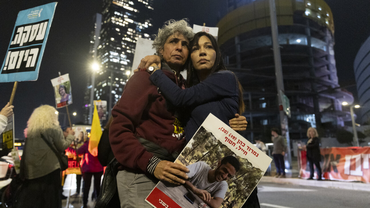 Protesters calling for the return of hostages held in the Gaza Strip react after a the ceasefire and hostage deal was announced.