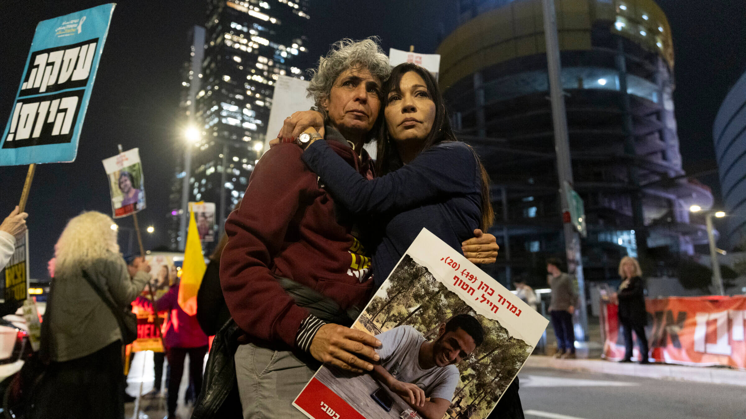 Protesters calling for the return of hostages held in the Gaza Strip react after a the ceasefire and hostage deal was announced.