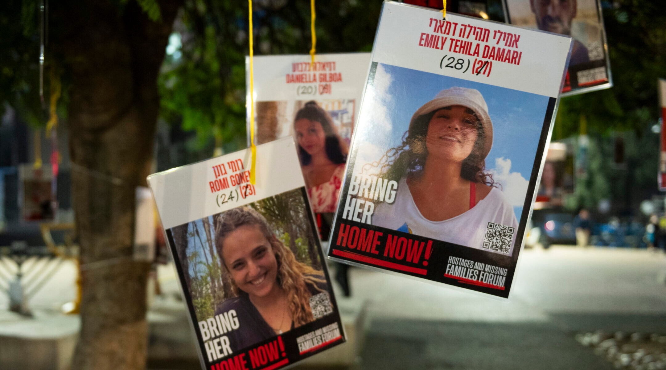 Posters of hostages Emily Damari and Romi Gonen, two of the first hostages Hamas said it would release from Gaza, are displayed at Tel Aviv’s Hostage Square, Jan. 16, 2025. (Noam Galai/Getty Images)