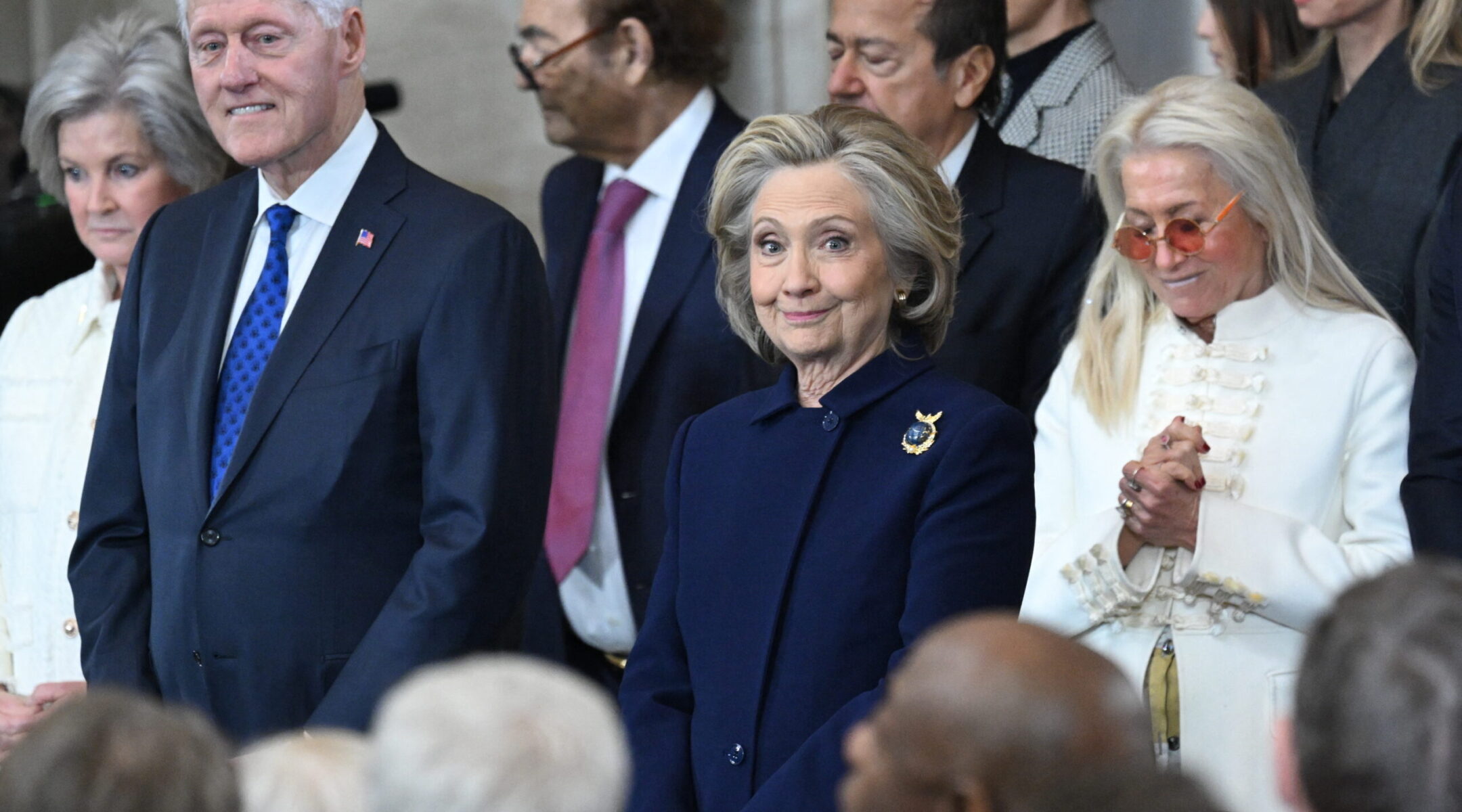 Former US Secretary of State Hillary Clinton stands next to Miriam Adelson as they attend the inauguration ceremony before Donald Trump is sworn in as the 47th US President in the US Capitol Rotunda in Washington, DC, Jan. 20, 2025. (Saul Loeb/Pool/AFP via Getty Images)