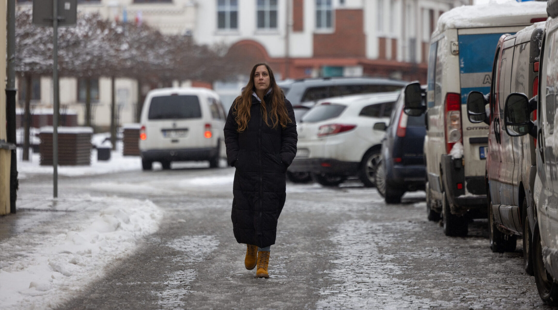 Hila Weisz-Gut, 34, an Israeli researcher in Holocaust studies who relocated to Oswiecim to be with her Polish husband, walks on the street in Oswiecim, Jan. 13, 2025.(Wojtek Radwanski/AFP via Getty Images)