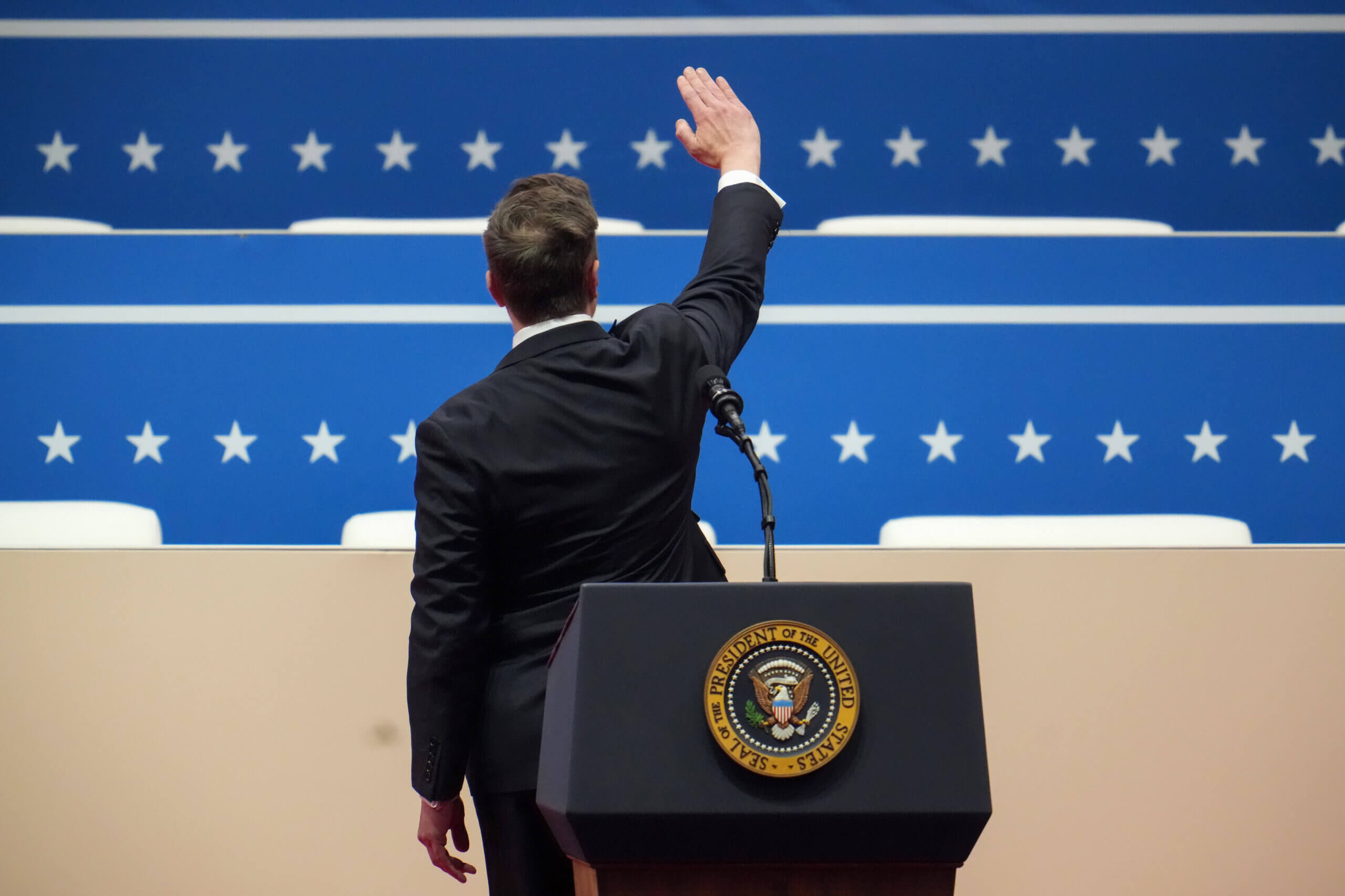 Elon Musk gestures while speaking during an inauguration event at Capital One Arena on Jan. 20, 2025.