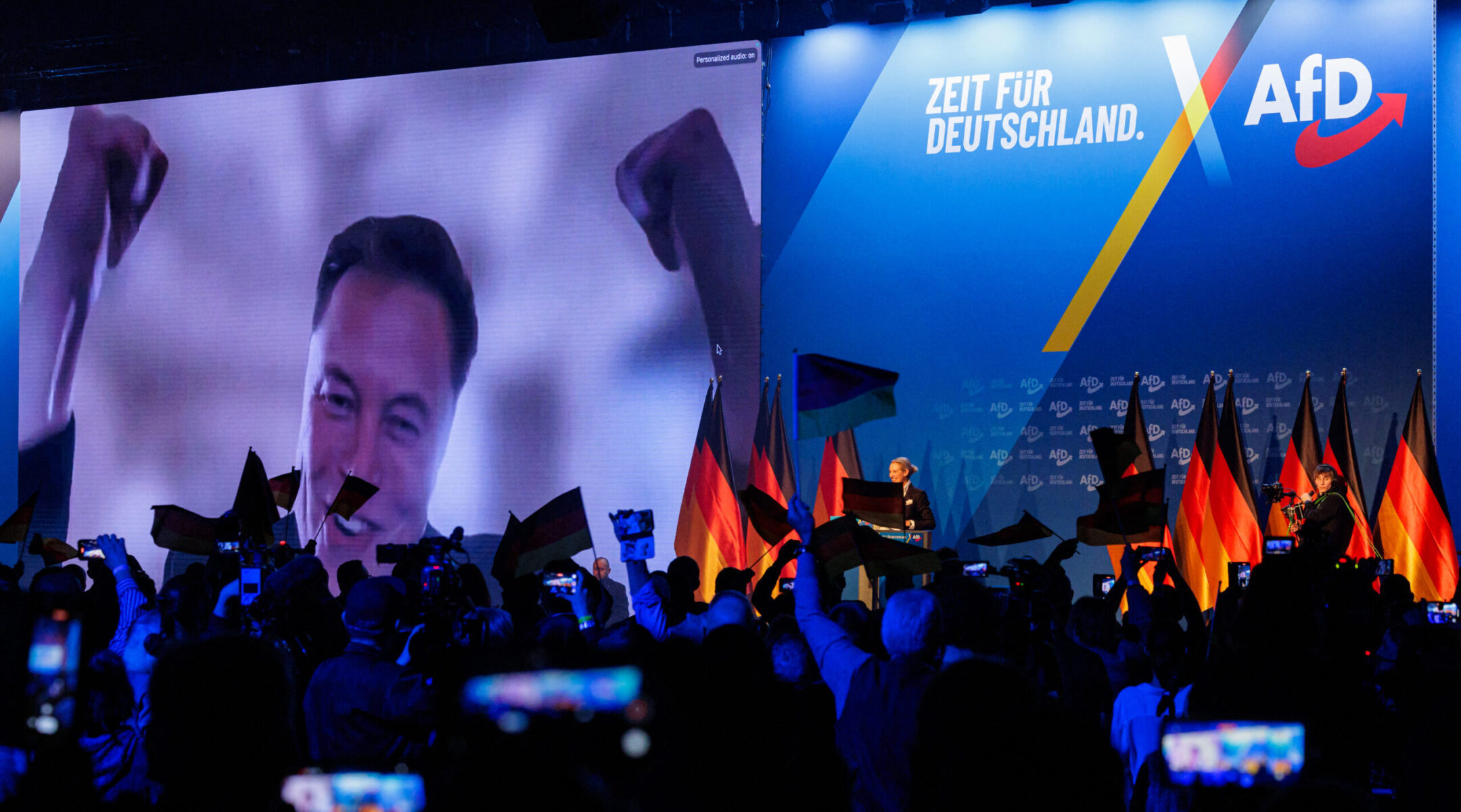 Elon Musk is seen on a large screen as Alice Weidel, co-leader of Germany’s far-right Alternative for Germany (AfD) party, addresses an election campaign rally in Halle, Germany, Jan. 25, 2025. (AFP via Getty Images)