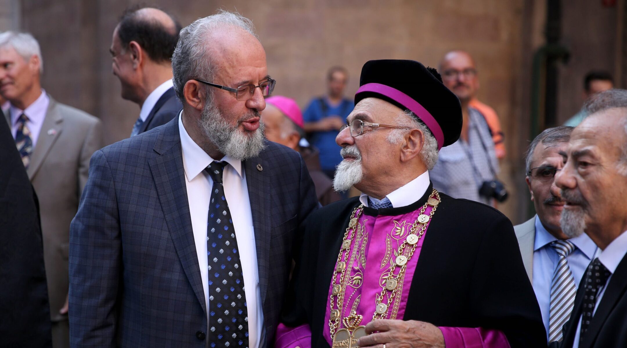 Chief Rabbi of the Jewish community in Turkey Isak Haleva, at right, speaks with the Mufti of Istanbul Rahmi Yaran during a July 2016 event in Istanbul. (Onur Coban/Anadolu Agency/Getty Images)