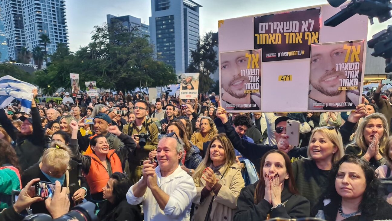 People gathered in what’s known as Hostages Square react to news that three Israeli hostages have been released after a ceasefire agreement began between Israel and Hamas, Jan. 19, 2025. (Deborah Danan)