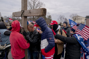 Demonstrators erect a wooden cross outside the U.S. Capitol in Washington, D.C., on Wednesday, Jan. 6, 2021. 