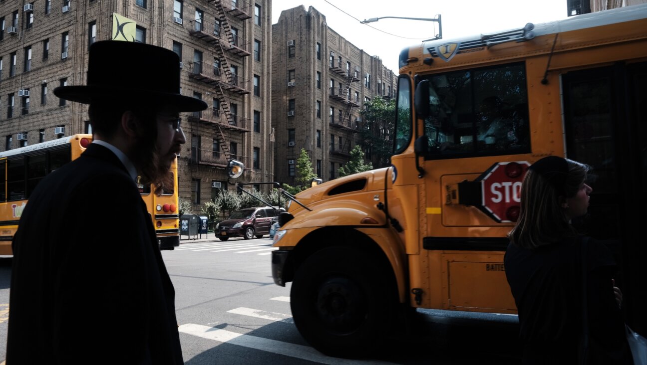 A yeshiva school bus drives through Broolyn on Sept. 12, 2022. (Spencer Platt/Getty Images)