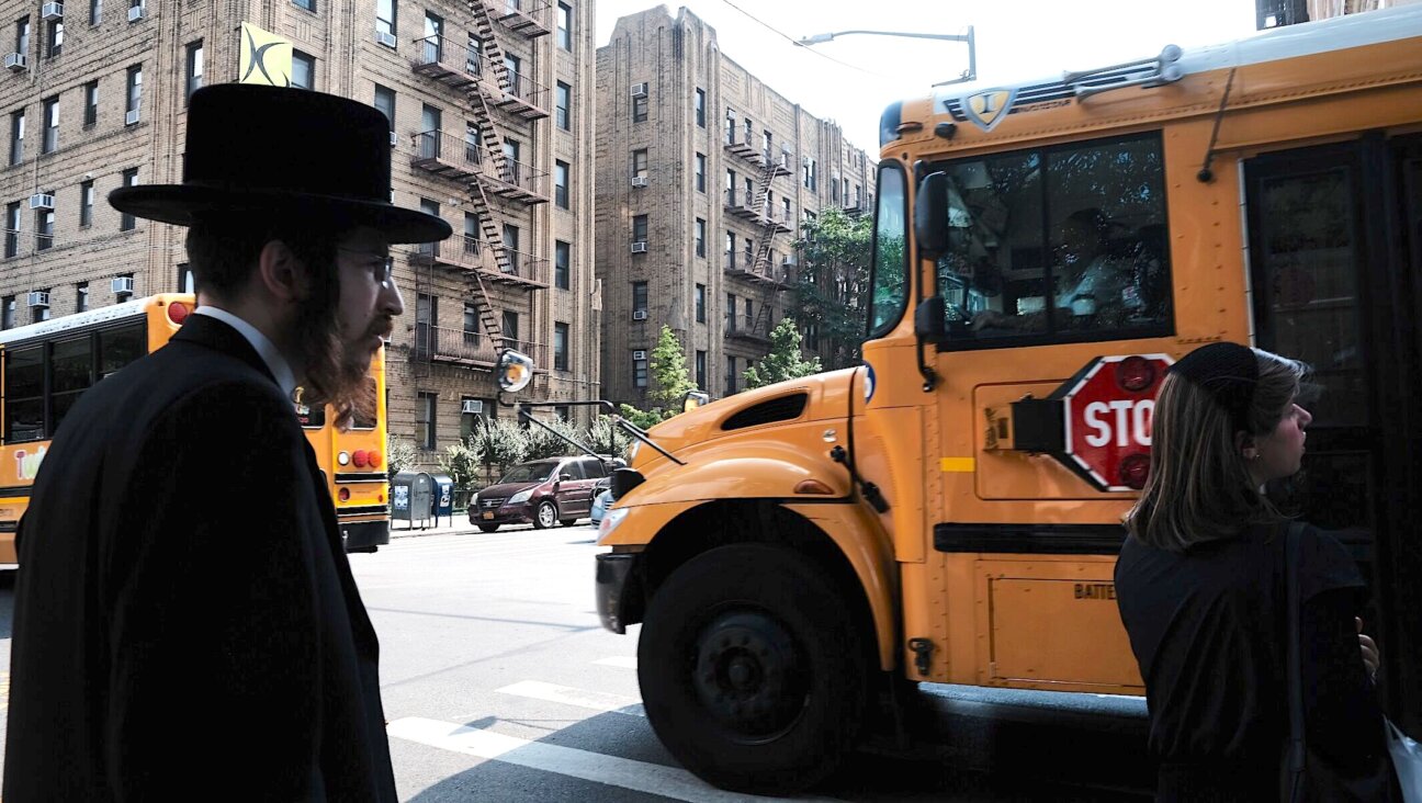 A yeshiva school bus drives through Broolyn on Sept. 12, 2022. (Spencer Platt/Getty Images)