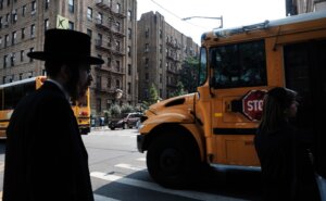 A yeshiva school bus drives through Broolyn on Sept. 12, 2022. (Spencer Platt/Getty Images)