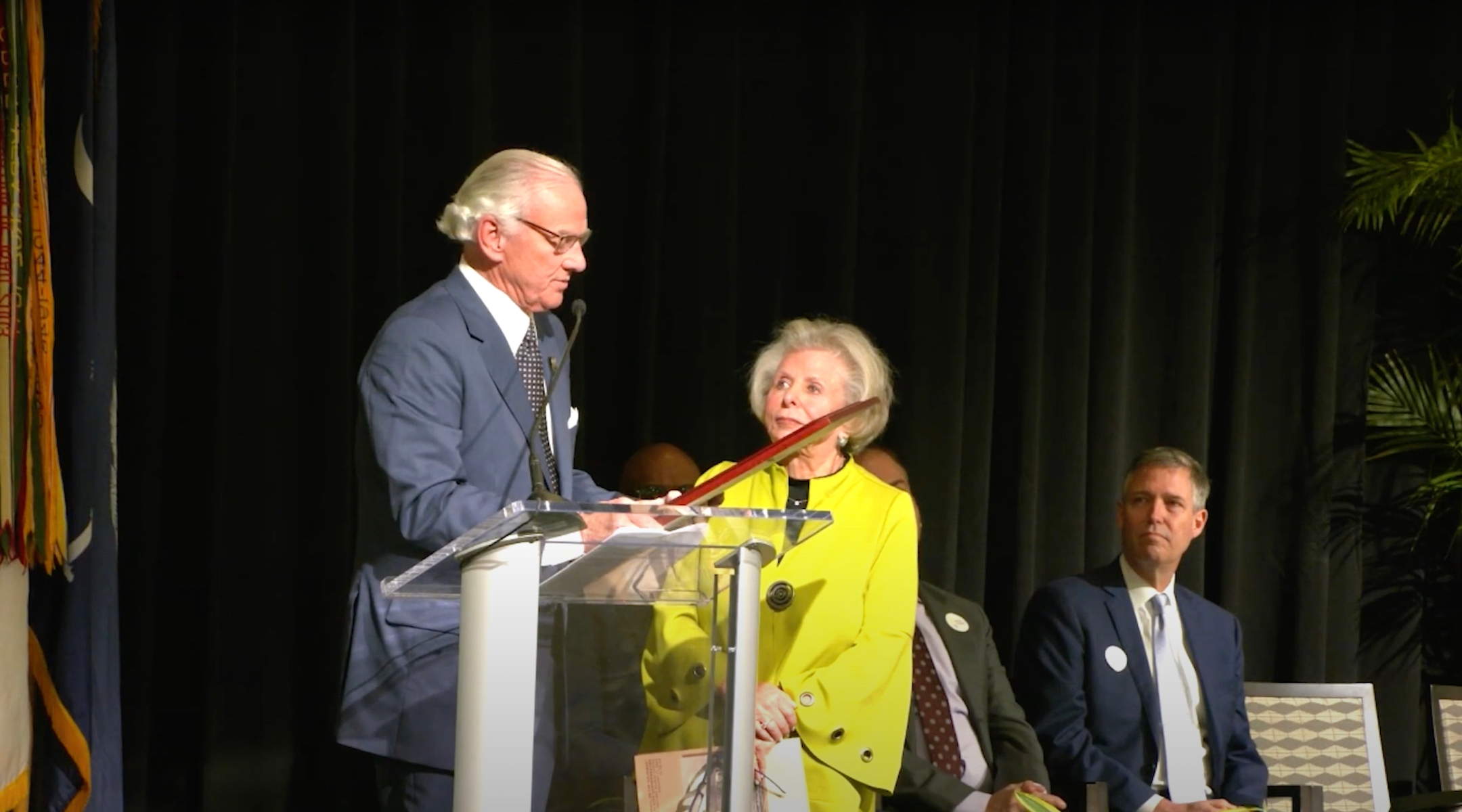 Lily Filler (in the center), chairman of the South Carolina Council on the Holocaust, adopts a state proclamation from governor Henry McMaster, recognizing the Holocaust during an event marking the 80th anniversary of the Liberation of Auschwitz, January 27, 2025, in Colombia, South On Auschwitz, January 27, 2025, in Colombia, South Carolina. Later, Filler would cut a speech from Rabbi from the broadcast. (Screenshot via YouTube)