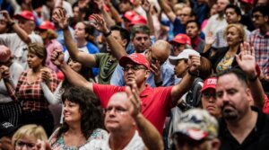 Attendees pray before President Donald Trump addresses the crowd at the King Jesus International Ministry during a “Evangelicals for Trump” rally in Miami, Florida, Jan. 3, 2020. (Scott McIntyre/For The Washington Post via Getty Images)