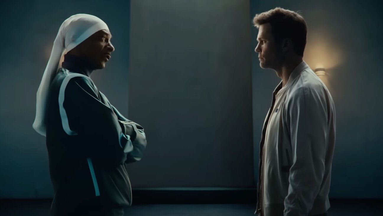 Snoop Dogg (left) and Tom Brady star in a Super Bowl ad calling out hate, produced by Robert Kraft’s foundation. (Screenshot)