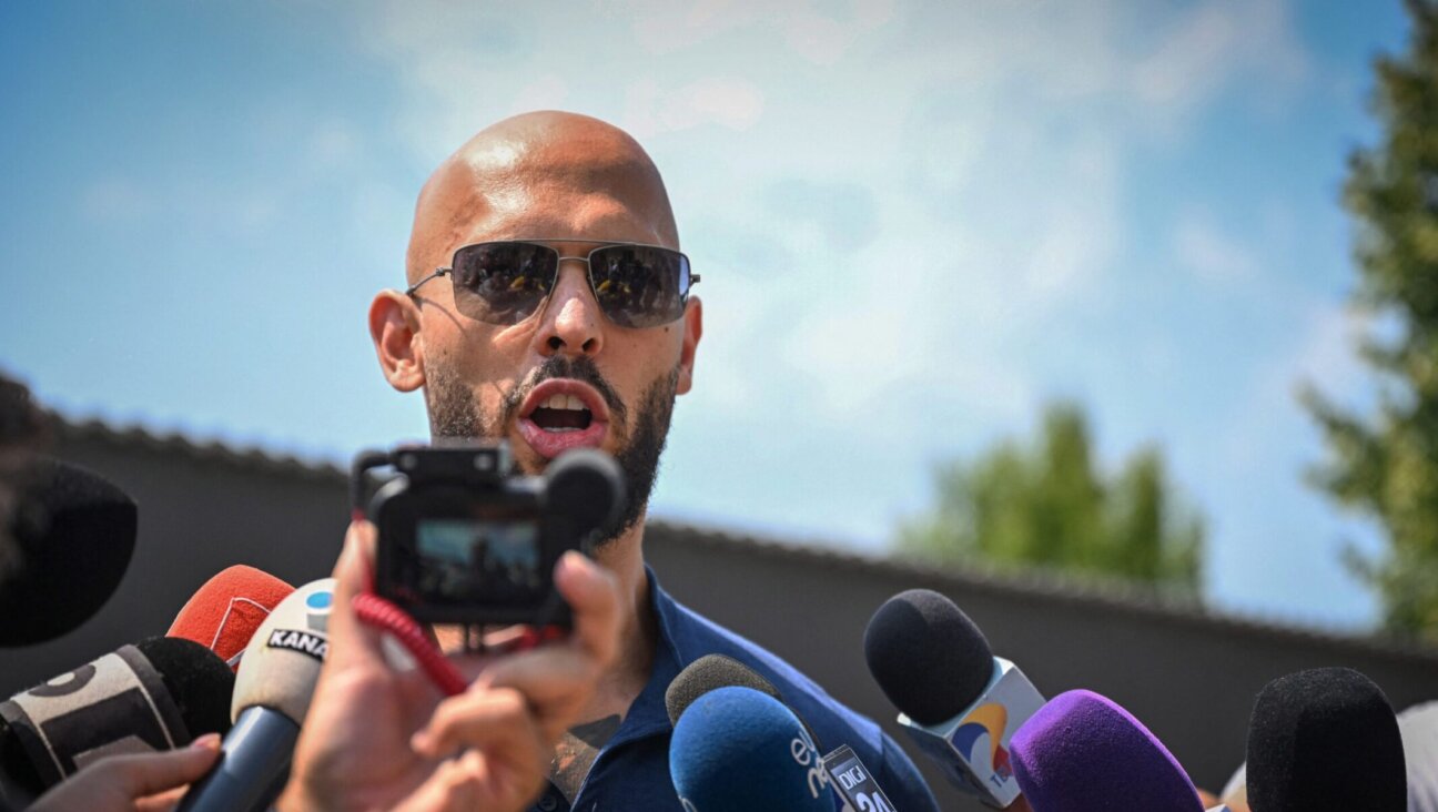 British-US former professional kickboxer and controversial influencer Andrew Tate addresses the media in Bucharest, Romania, Aug. 4, 2023. (Daniel Mihailescu/AFP via Getty Images)