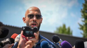 British-US former professional kickboxer and controversial influencer Andrew Tate addresses the media in Bucharest, Romania, Aug. 4, 2023. (Daniel Mihailescu/AFP via Getty Images)