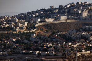 The village of Al-Ram and an Israeli settlement in the occupied West Bank territory seperated by a wall on Nov. 04, 2023. 