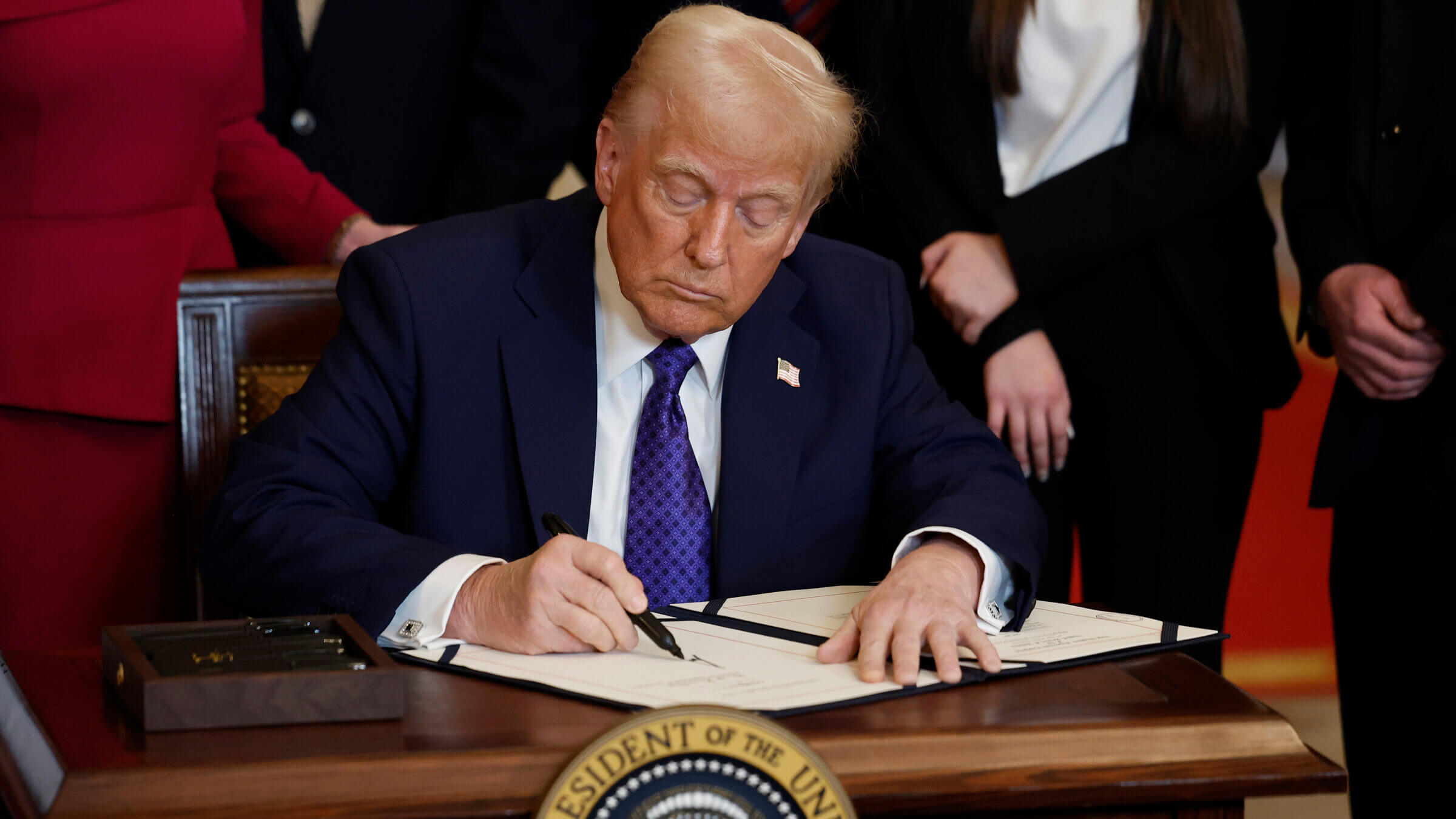 President Trump, signing one of many pieces of anti-immigration law he has said his administration plans.