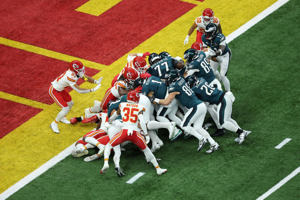 Jalen Hurts of the Philadelphia Eagles scores a touchdown using the "tush push" play in the first quarter against the Kansas City Chiefs during Super Bowl LIX in New Orleans.