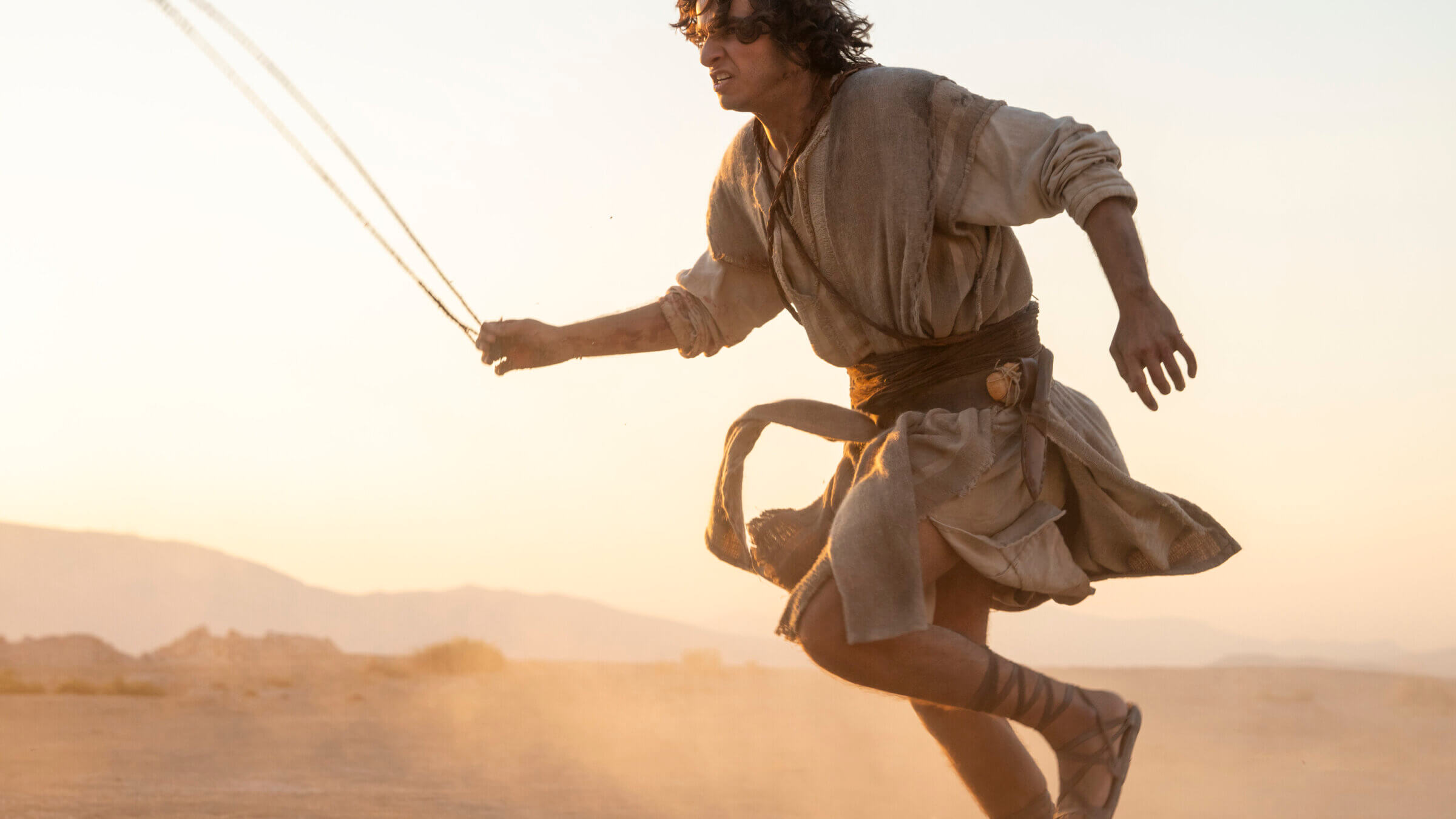 David and his slingshot in the famous moment as he confronts Goliath.