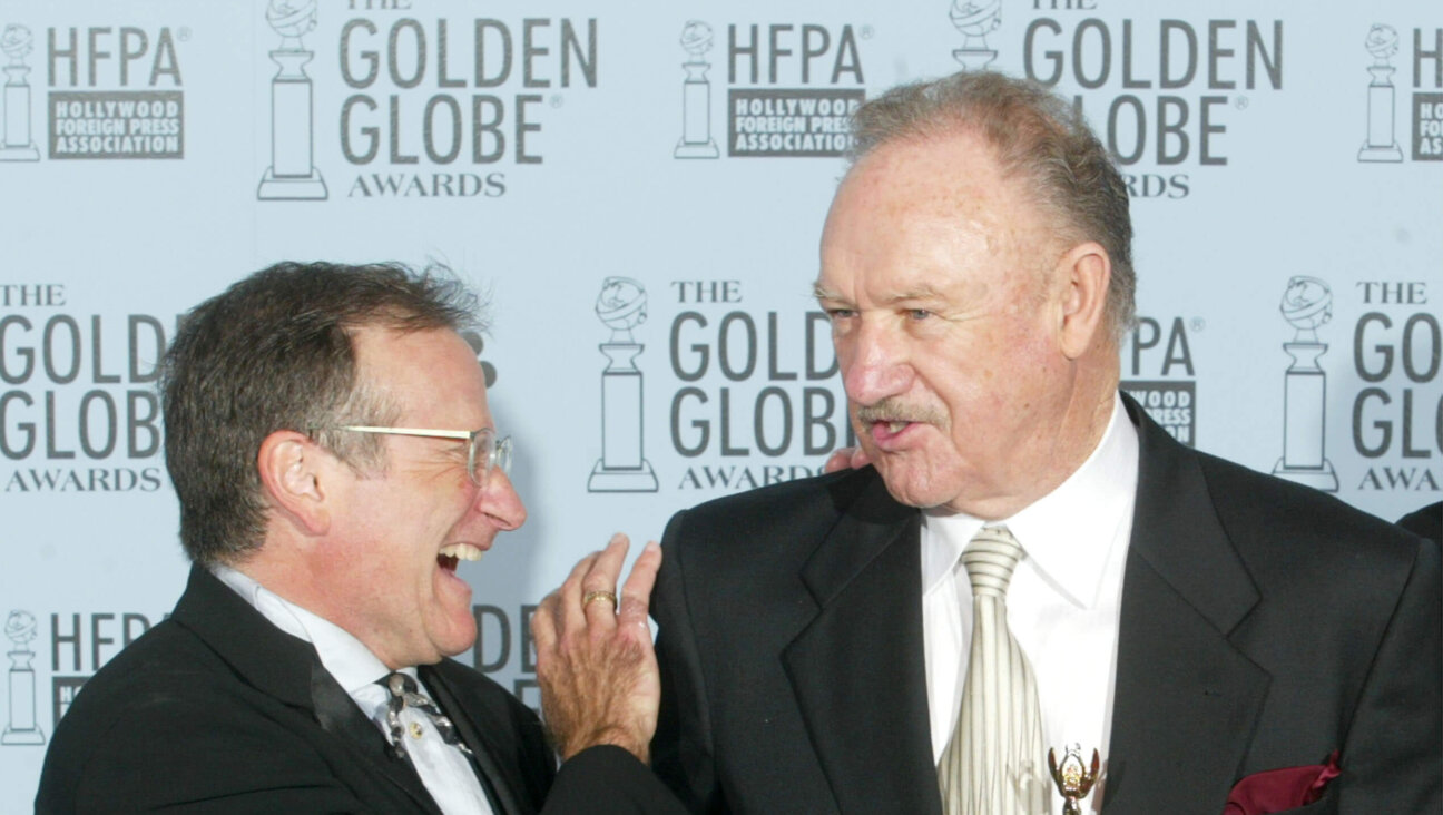 Robin Williams (L) and Gene Hackman pose backstage during the 60th Annual Golden Globe Awards at the Beverly Hilton Hotel on Jan. 19, 2003. 