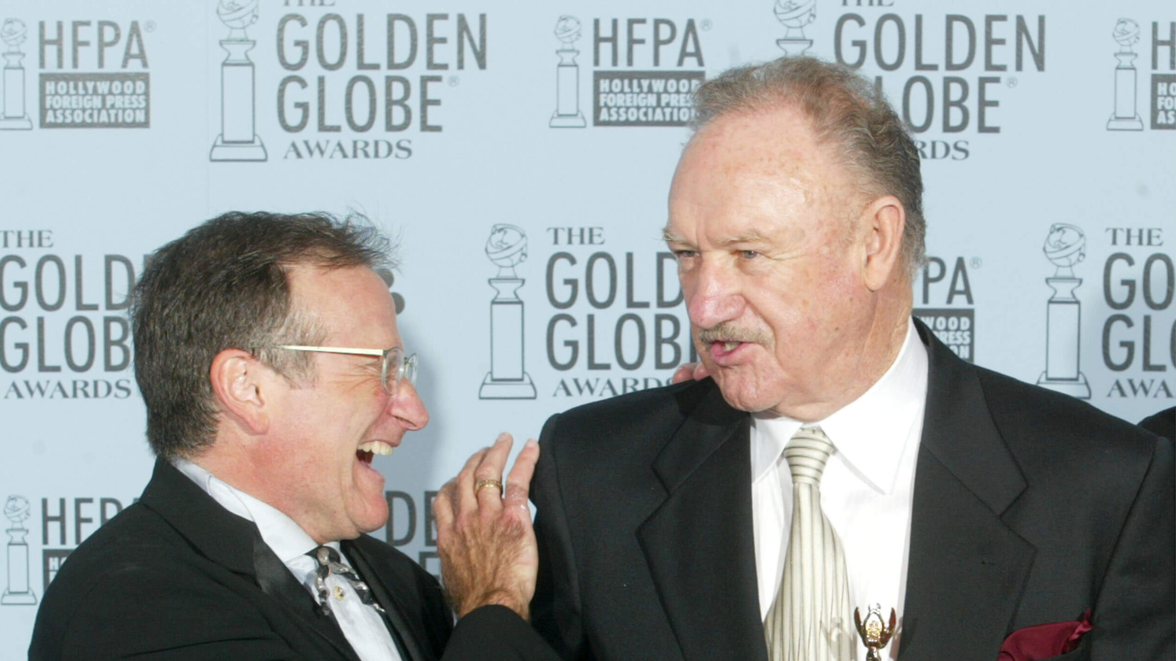 Robin Williams (L) and Gene Hackman pose backstage during the 60th Annual Golden Globe Awards at the Beverly Hilton Hotel on Jan. 19, 2003. 