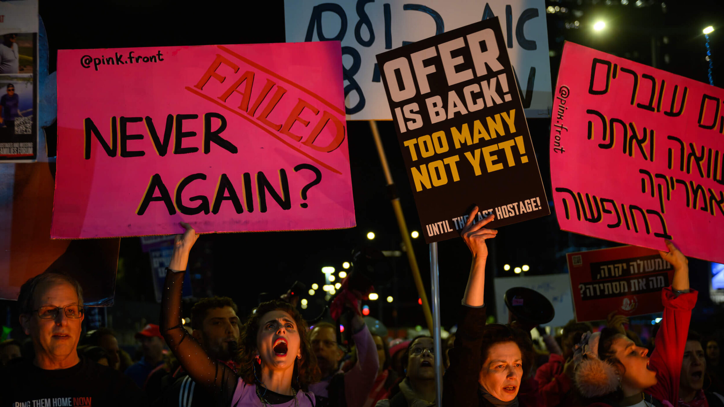 Protestors chant and call for the ceasefire deal to continue while holding a banner that reads "Never Again: Failed" during an anti-government demonstration in Tel Aviv on Feb. 8.