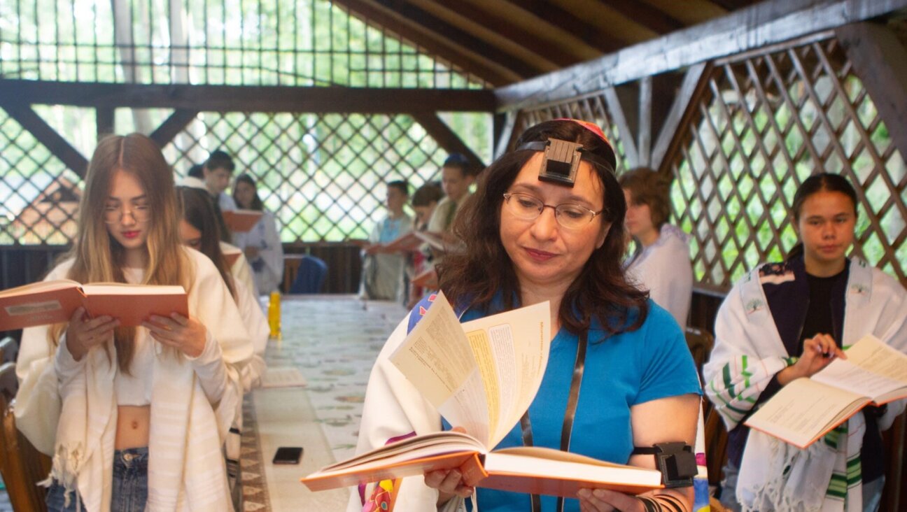 Rabbi Irena Gritsevskaya leads prayers from a new Ukrainian-language siddur. (Courtesy Midreshet Schechter, TALI, Masorti Olami)