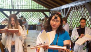 Rabbi Irena Gritsevskaya leads prayers from a new Ukrainian-language siddur. (Courtesy Midreshet Schechter, TALI, Masorti Olami)