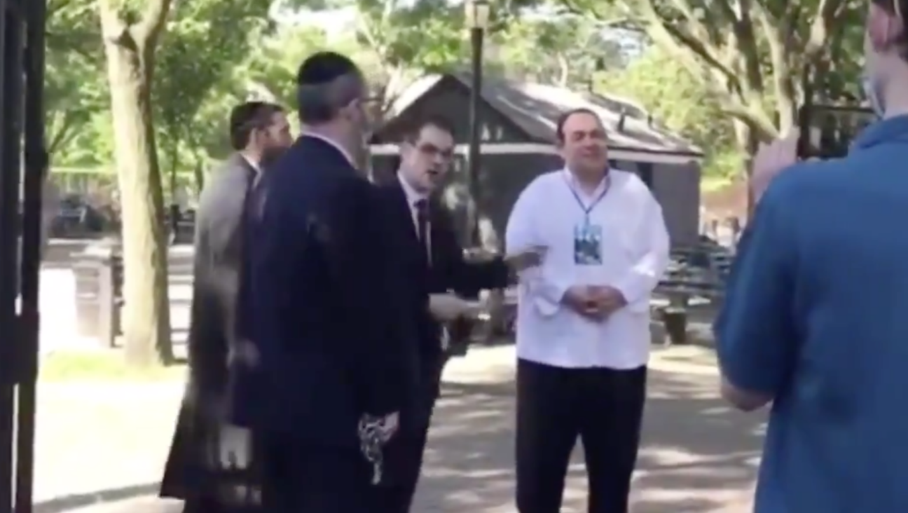 State Sen. Simcha Felder, left, and Heshy Tischler, center, pictured in 2020 cutting chains of playground gates.