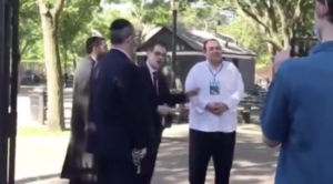 State Sen. Simcha Felder, left, and Heshy Tischler, center, pictured in 2020 cutting chains of playground gates.