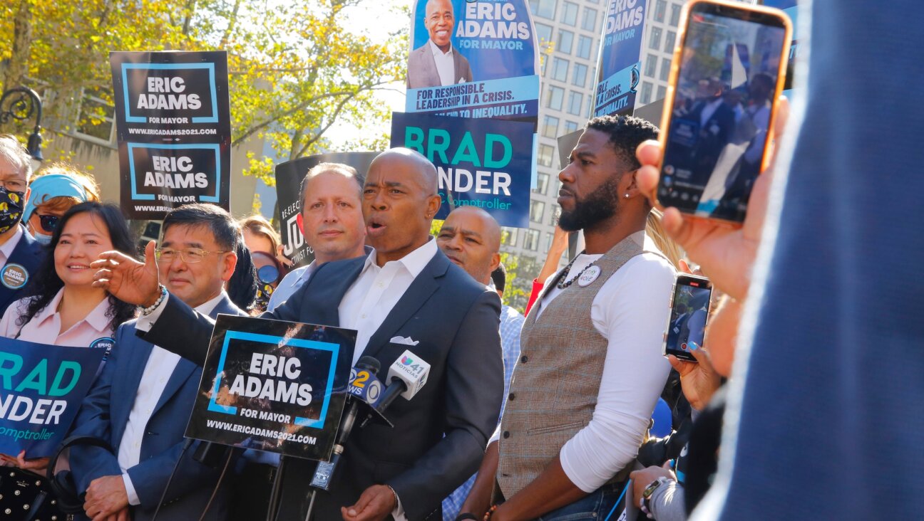 Democratic NYC mayoral candidate Eric Adams, center, speaks during a Get Out the Vote rally with New York City Public Advocate Jumaane Williams, right, and New York City Public Advocate and comptroller candidate Brad Lander, left, in front of Brooklyn Borough Hall, Oct. 22, 2021. (Michael M. Santiago/Getty Images)