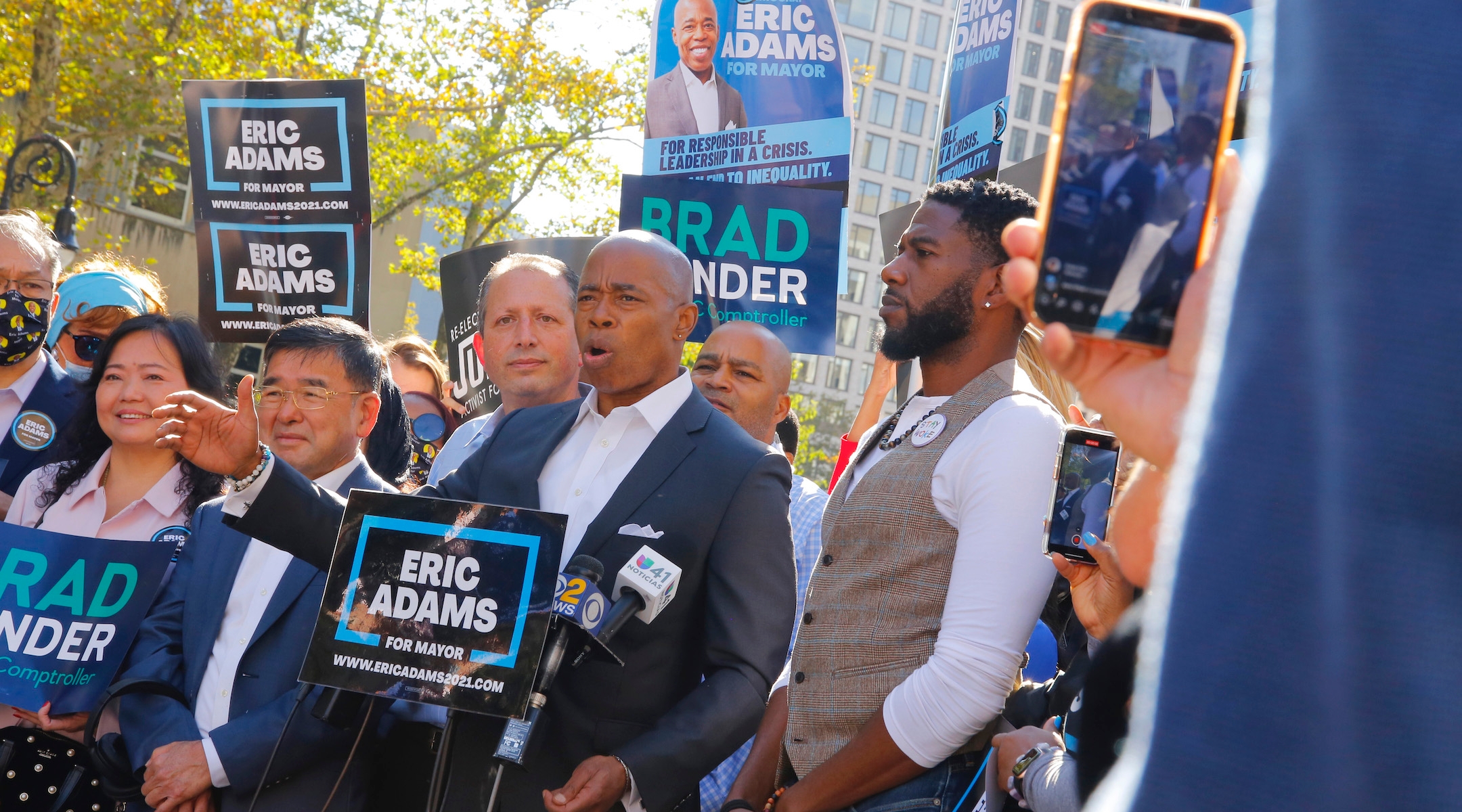 Democratic NYC mayoral candidate Eric Adams, center, speaks during a Get Out the Vote rally with New York City Public Advocate Jumaane Williams, right, and New York City Public Advocate and comptroller candidate Brad Lander, left, in front of Brooklyn Borough Hall, Oct. 22, 2021. (Michael M. Santiago/Getty Images)