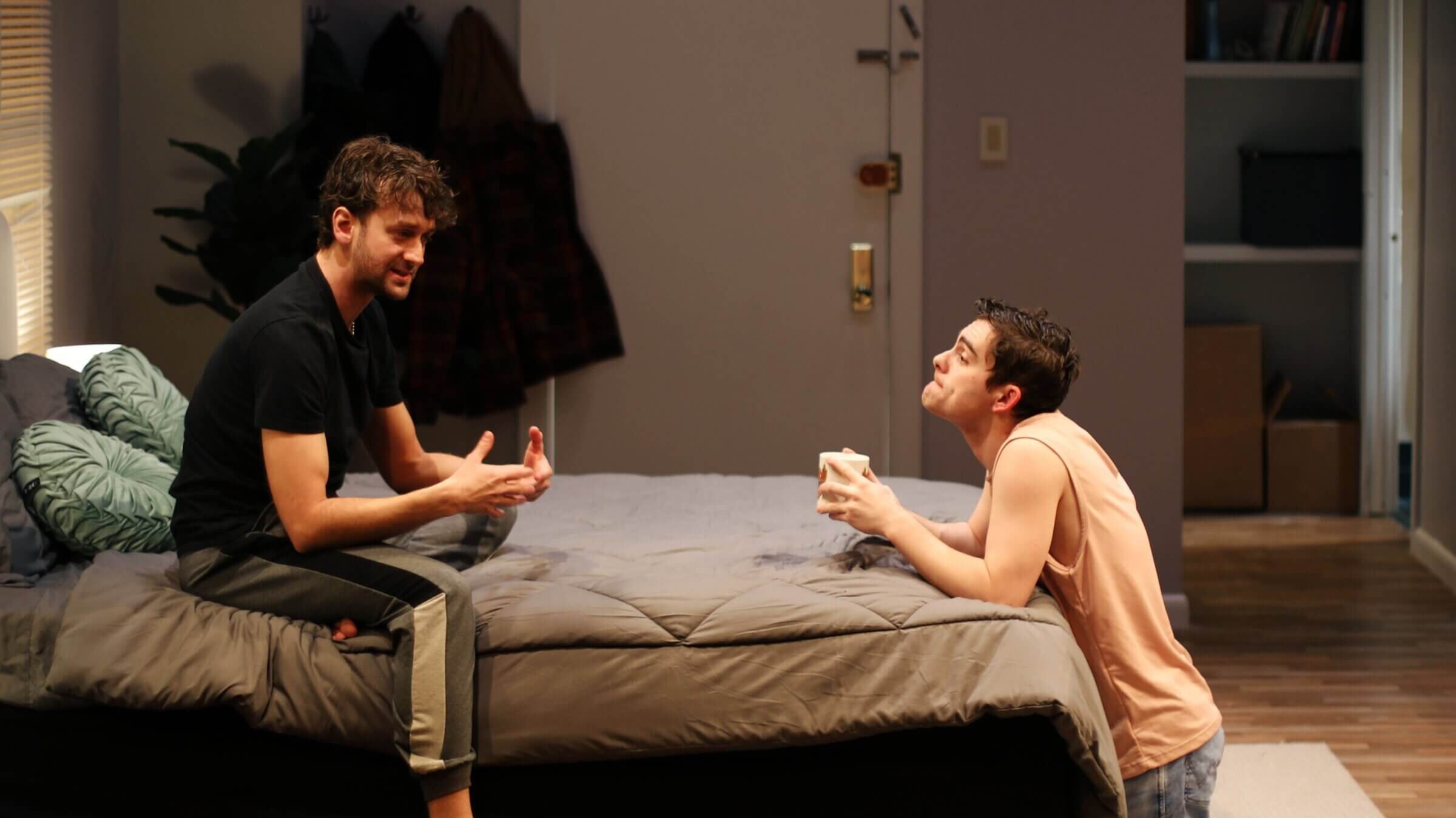 Ephraim Burney (left) stars in <i>As Time Goes By</i> as Adam, a commitment-phobic, 33-year-old New Yorker who swipes right on David (Joel Myers, right) and gets more than what he bargained for. 